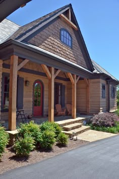 the front porch of a log cabin style home