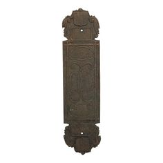 an old fashioned metal door with carvings on it