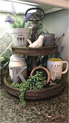 a potted plant sitting on top of a wooden tray filled with coffee mugs