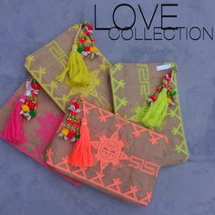 three bags with tassels on them and the words love collection written in large letters