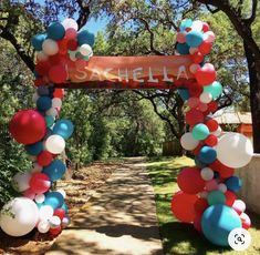 an arch decorated with balloons and streamers