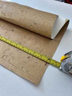 there is a tape measure next to some cork