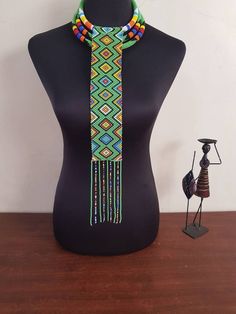 This set is perfect for weddings, traditional events , African themed events etc. *This set makes a perfect gift. In this listing, you will get both necklaces like shown above. *Long pendant necklace. *2 in 1 necklace. Custom orders are welcome. More neckleces here; https://www.etsy.com/shop/TribalTess?ref=seller-platform-mcnav&section_id=21306083 Back to my shop; https://www.etsy.com/shop/TribalTess?ref=seller-platform-mcnav Traditional Green Adjustable Necklace, Beaded Necklaces For Traditional Ceremonies And Festivals, Traditional Adjustable Necklaces With Colorful Beads, Traditional Adjustable Necklace With Colorful Beads, Necklace With Colorful Round Beads For Traditional Ceremonies, Traditional Adjustable Beaded Choker Necklace, Traditional Handmade Beaded Necklaces For Ceremonies, Multicolor Beaded Necklaces For Traditional Ceremonies, Traditional Necklaces With Colorful Beads And Adjustable Fit