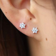 • Our sweet and dainty mini flower earrings are an essential! • Hypoallergenic, lead-free, tarnish/scratch resistant material • Length: Approx. 1.2mm • Material: Surgical Steel, Sterling Silver • Available in Silver Ear Piercing Studs, Beautiful Flower Designs, Flower Ear, Stud Jewelry, Tiny Stud Earrings, Girl Jewelry, Ear Piercing, Flower Earrings Studs, Opal Earrings