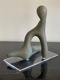 a sculpture sitting on top of a black table