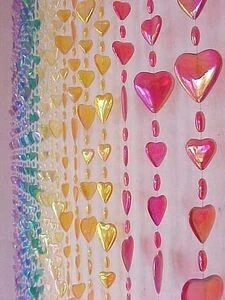 there are many hearts hanging on the wall