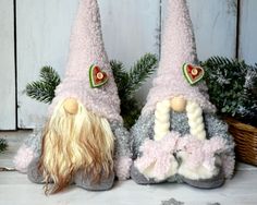 two gnome slippers sitting next to each other