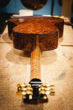 a close up of a guitar on a table