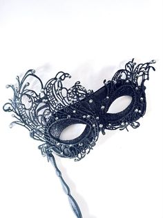 Elegant Venetian stick mask with lace overlay, adorned with 50 rhinestones in the color of your choice. Thank you for supporting small businesses and hope our products bring you and loved ones some joy and humor in these trying times.      S I Z E  Measures approx. 7.5 inches in length, 2.5 inches in Width from forehead to nose.  Dimensions available upon request.  C U S T O M I Z A T I O N If you would like to color & embellish the mask to match your costume/dress, pls get in touch, we love to Mask Butterfly, Elegant Face Mask, Thank You Wishes, Metal Mask, Prom Dance, Carnival Festival, Masquerade Masks, Costume Masks, Children's Mask