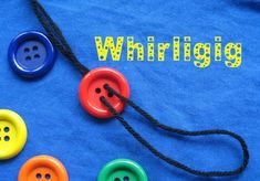 four different colored buttons on a blue shirt with the words whirling written in yellow