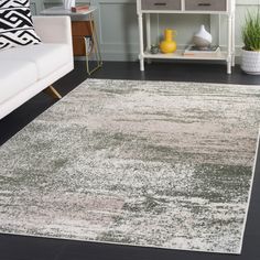 a white and gray rug in a living room