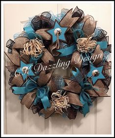 a blue and brown mesh wreath with stars on it