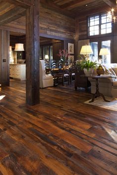 a living room filled with furniture and wooden floors