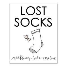 a white poster with the words lost socks and a pair of socks in black ink