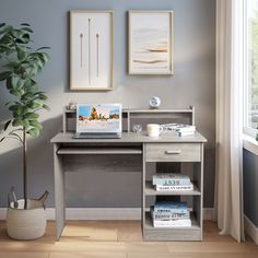 a laptop computer sitting on top of a wooden desk next to a potted plant