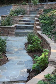 a stone walkway with steps leading up to it