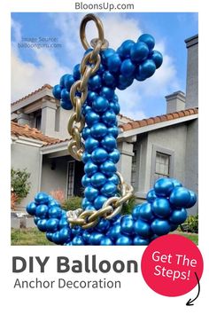 an anchor made out of blue balloons in front of a house with the words diy balloon