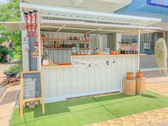 an outdoor bar with lots of items on display