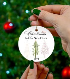 New Home Holiday Decoration, First Christmas 2024, Housewarming Gift, New Home Decor, Memory Keepsake, Christmas Tree Ornament, Three trees Celebrate the first Christmas in a new home with this ceramic ornament. Perfect for adding a special touch to your holiday decor, this ornament features vibrant colors and a glossy finish. Ideal for those who have recently moved or purchased a new home, this ornament is a wonderful keepsake for the 2024 holiday season. Product features - Vibrant colors for crisp designs - Solid one-piece construction - Hole for hanging string with gold-toned string included - 0.125" thick high-quality ceramic Care instructions - Gently wipe the dirt or dust off with a clean, dry microfiber cloth New Home Decor, Memorial Keepsakes, Christmas Decoration Items, Christmas Tree Ornament, Christmas 2024, Tree Ornament, Microfiber Cloth, Ceramic Ornaments, First Christmas