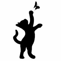 a black and white silhouette of a cat reaching for a butterfly