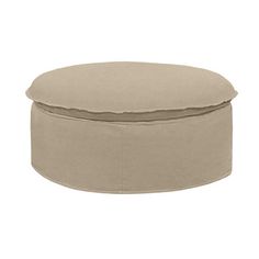 a round ottoman that is sitting on top of a white surface with a beige cover