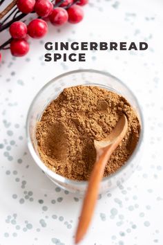 the ingredients to make gingerbread spice in a small glass bowl with a wooden spoon