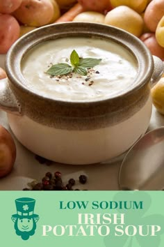 a bowl filled with soup next to some apples