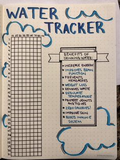 a notebook with water tracker written on it