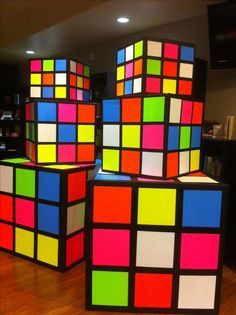 several colorful cubes sitting on top of a hard wood floor