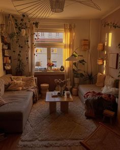 a living room filled with furniture and plants