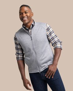 This Baybrook Heather Vest is the timeless vest you'll reach for as the temps drop. This classic silhouette is crafted with a lightweight heathered material that is the perfect pair for holiday sport shirts. This men's vest is great for every occasion from crisp weekday evenings to festive holiday gatherings. Style: 10058 Classic Outdoor Vest, Classic Sleeveless Vest For Outdoor, Gameday Fashion, Lightweight Vest, Sport Shirts, Sophisticated Dress, Men's Vest, Cute Swimsuits, Comfy Sweaters