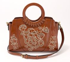 Elevate your style with this leather satchel. Featuring elegant round handles, an adjustable and detachable shoulder strap, and a spacious interior, it meets the needs of any occasion. From Patricia Nash. Brown Satchel With Round Handles, Artisan Satchel Shoulder Bag With Hand Tooled Details, Vintage Brown Hand Tooled Shoulder Bag For Daily Use, Hand Tooled Vintage Brown Bohemian Shoulder Bag, Retro Vintage Brown Hand Tooled Shoulder Bag, Vintage Brown Hand Tooled Crossbody Shoulder Bag, Leather Satchel, Fashion Handbags, Faux Suede