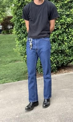 Styling Cowboy Boots With Jeans, Compression Shirt Outfit Aesthetic, Levi’s 505 Outfit Men, Wide Fit Jeans Outfit Men, 80s Jeans Men, Jeans With Boots Men, Levis 517 Outfit Men, Men’s Surfer Fashion, 90s Minimalism Fashion Men