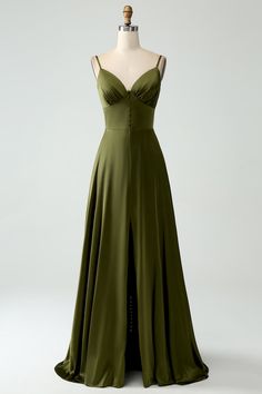 a green dress on a mannequin dummy