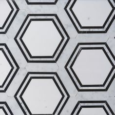 hexagonal marble tiles with black and white lines in the center, all lined up against each other