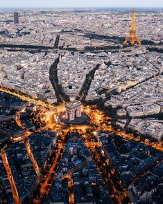 an aerial view of the eiffel tower and surrounding buildings at night in paris, france