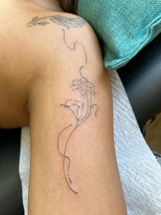 a woman with a tattoo on her arm