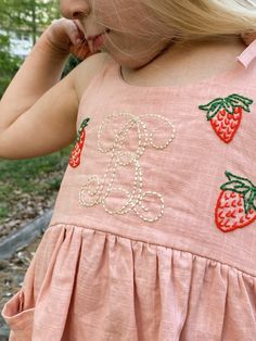 "Personalized Hand Embroidered Toddler Linen Dress Please indicate name or design to be embroidered and choice of font style, dress size, and thread color in the \"add your personalization section\". Dress sizes: 2T to 5T See photo slides for dress and thread colors. For Rush Shipping - https://www.etsy.com/listing/1392089058/rush-order. Please message us before choosing the rush shipping option so we can ensure your item is in stock. Merchandise is not kept on hand and is ordered as needed from Girls Cotton Dress, Photo Slides, Kids Party Wear Dresses, Girls Cotton Dresses, Kids Party Wear, Kids Dress Wear, Handmade Embroidery Designs