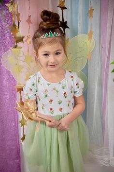 The Tinker Bell Princess Dress is a green tulle tutu dress ideal for girls, especially as a princess gown for toddlers during dress-up or for enhancing their collection of dress-up clothes. Its twirly skirt brings an extra layer of magic and joy to little girls' dress-up moments.𝐃𝐄𝐓𝐀𝐈𝐋𝐒👗 Above knee/Knee in length👗 Unique print not sold elsewhere👗 Size chart is photos👗 Super soft top👗 Super soft tulle with satin lining👗 Short sleeve👗 No pilling, shrinking or fading Bell Princess, Tulle Tutu Dress, Twirly Skirt, Green Tulle, Girls Dress Up, Princess Gown, Dress Up Outfits, Tulle Tutu, Soft Tulle