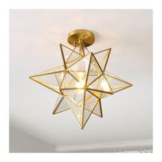 a star shaped light fixture hanging from the ceiling