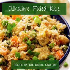 a blue bowl filled with rice and vegetables