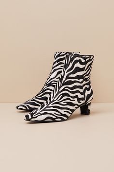 Throwback-chic meets modern perfection in the Steve Madden Delvie-A Zebra Calf Hair Pointed-Toe Ankle Boots! Sleek, genuine calf hair (with a black and white zebra print throughout) shapes these fun booties with a pointed-toe upper that rises to an ankle-high shaft. A 6.5"" zipper at the instep makes for effortless on-and-off, while a low blade heel completes the look! 2" blade heel. Lightly cushioned insole. Rubber sole has nonskid markings. Genuine leather upper and sock. Synthetic lining. Bal Ankle High Heel Boots, Shoes Boots Ankle, White Zebra, Calf Hair, Heel Boots, Zebras, Short Boots, High Heel Boots, Zebra Print