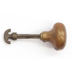 an old brass door handle with a screw