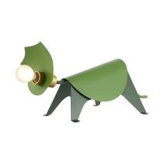 a green dog lamp with a light on it's head and tail that is shaped like a leaf