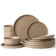 a set of beige dishes and cups on a white background