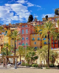 the city has many colorful buildings and palm trees