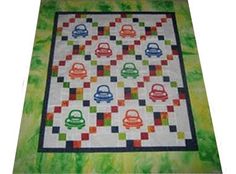 a colorful quilt with cars on it