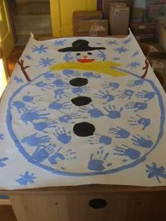 a child's handprinted snowman bed spread