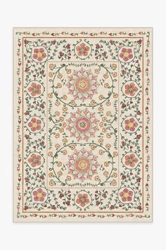 an intricately designed rug with flowers and leaves on the border, in white background