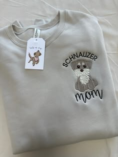 a white shirt with a dog on it and the words schnauzer mom